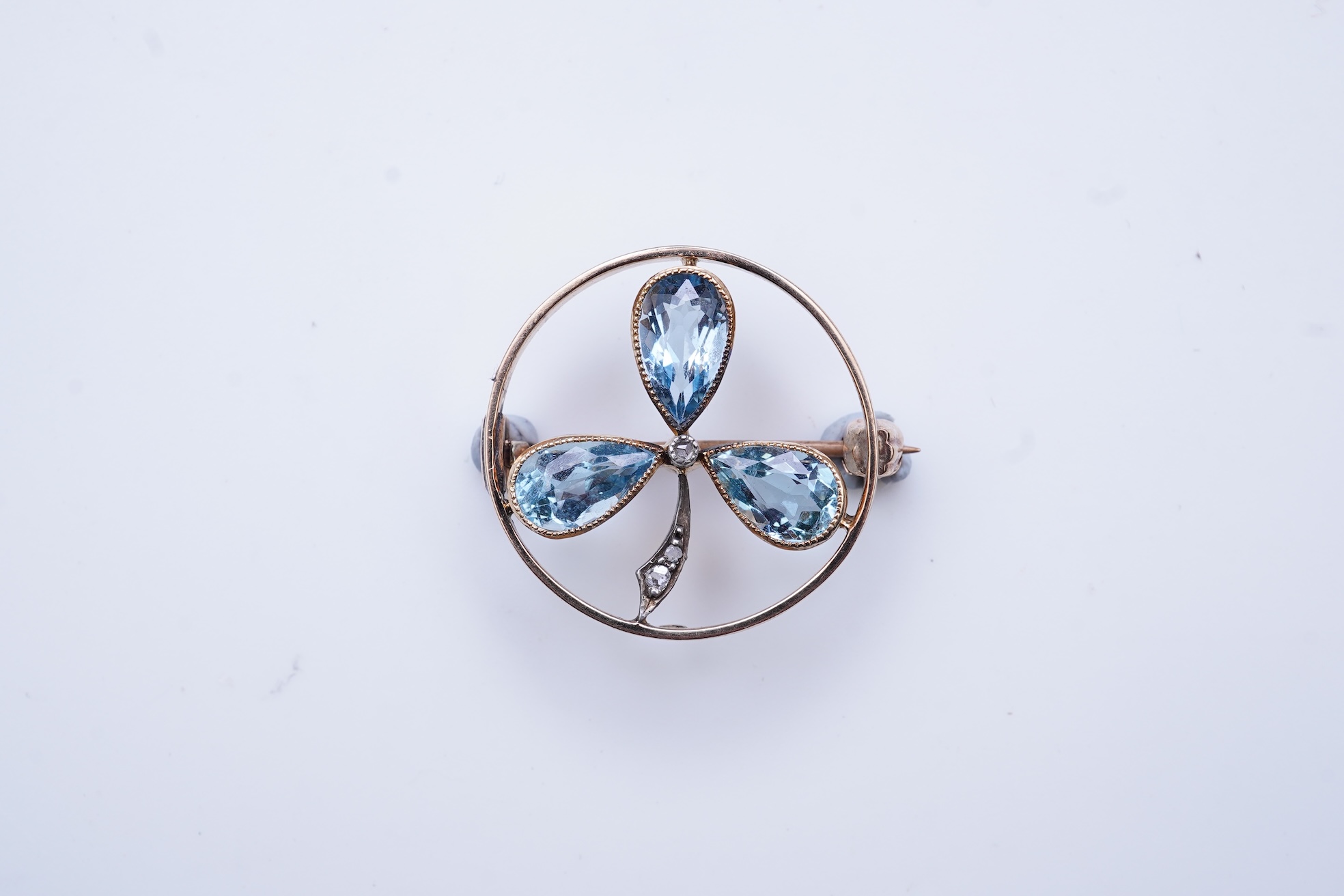 An aquamarine and diamond brooch, early 20th century